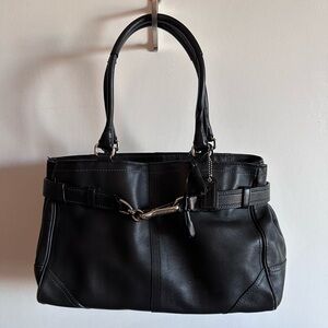 Coach black leather bag with blue stitching.